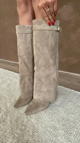 Gold-buckle pointed knee-high boots, side view