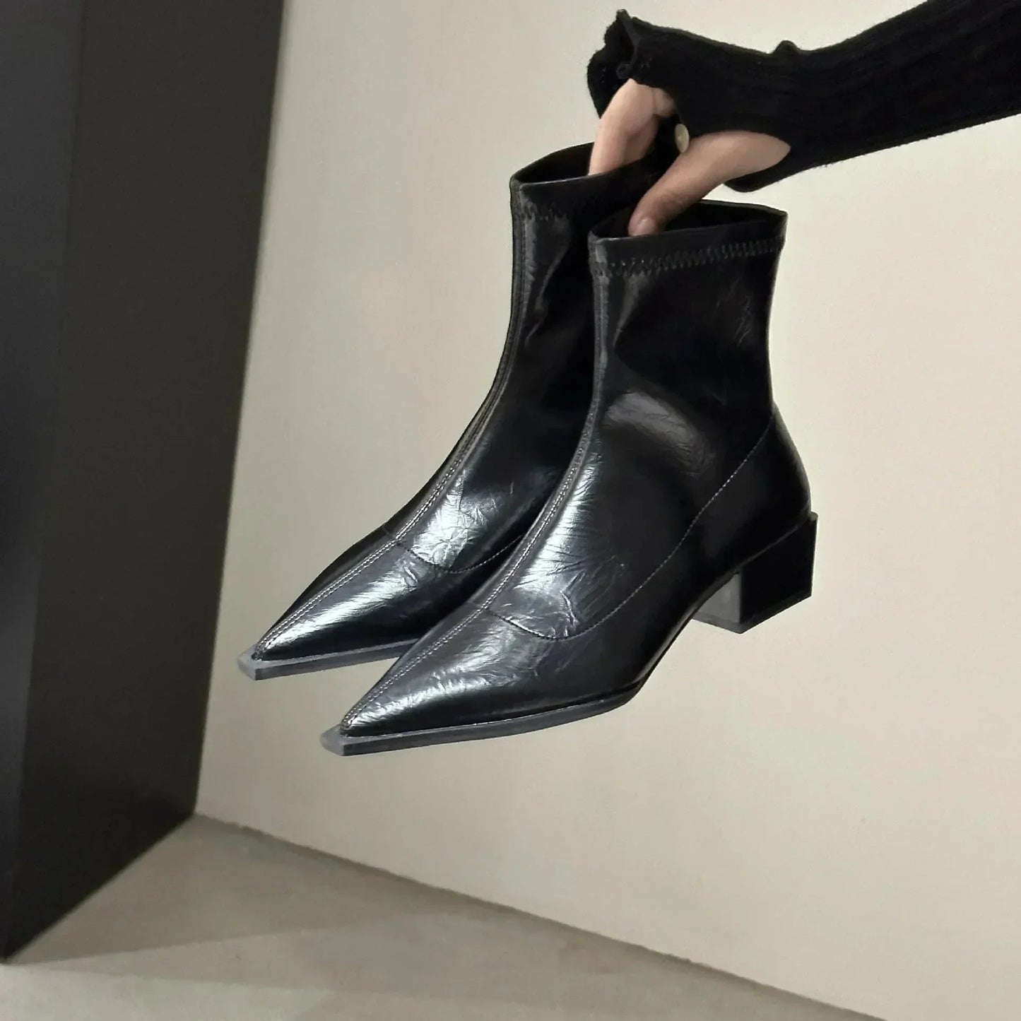 Pointed ankle boots shown in black