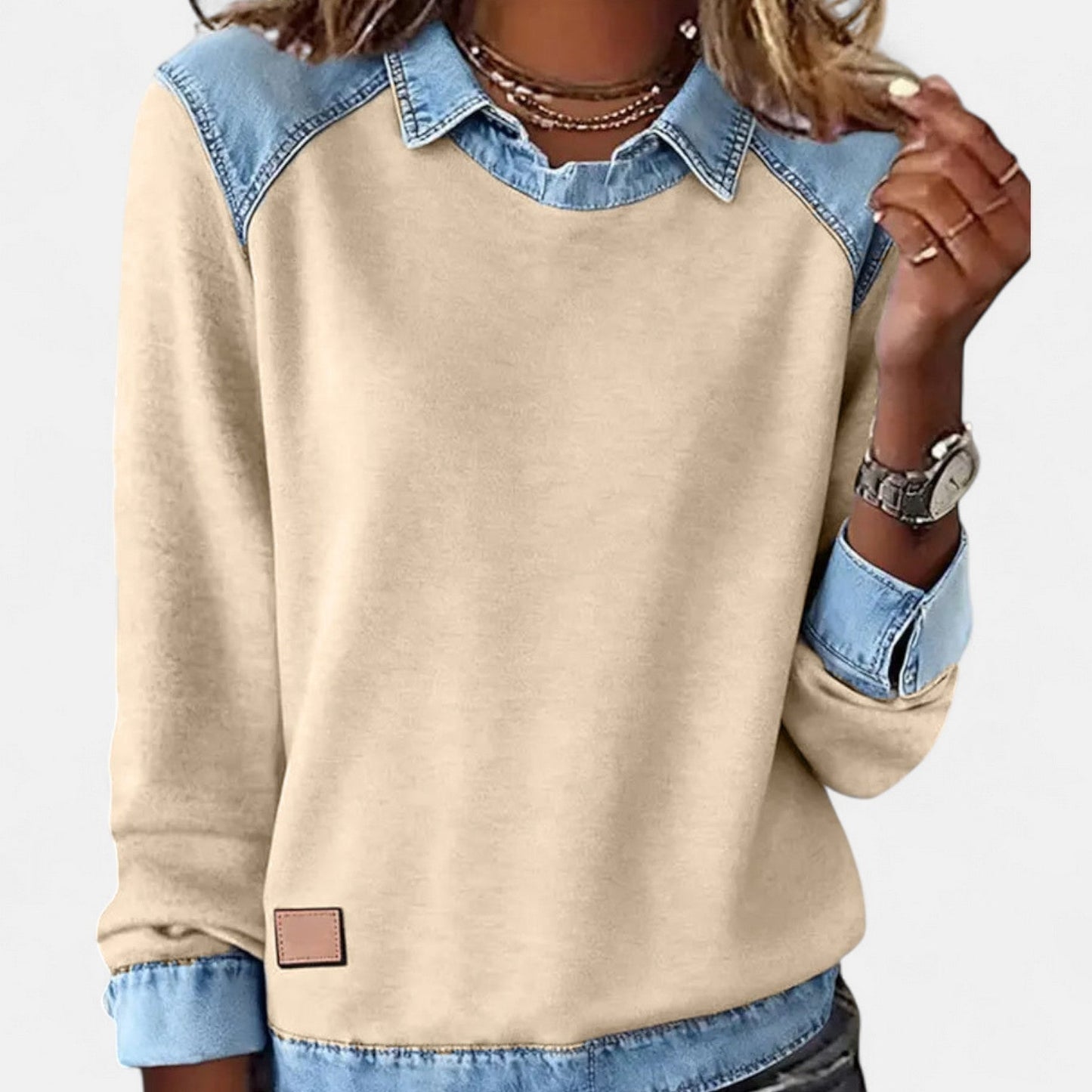 Long-sleeve knit sweater photographed at an angle