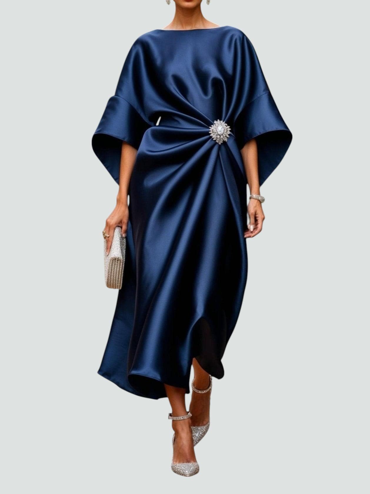 Draped midi dress with a statement brooch at the waist, front view