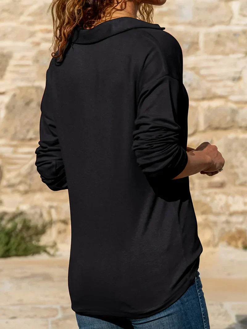 Half-zip sweater photographed at an angle