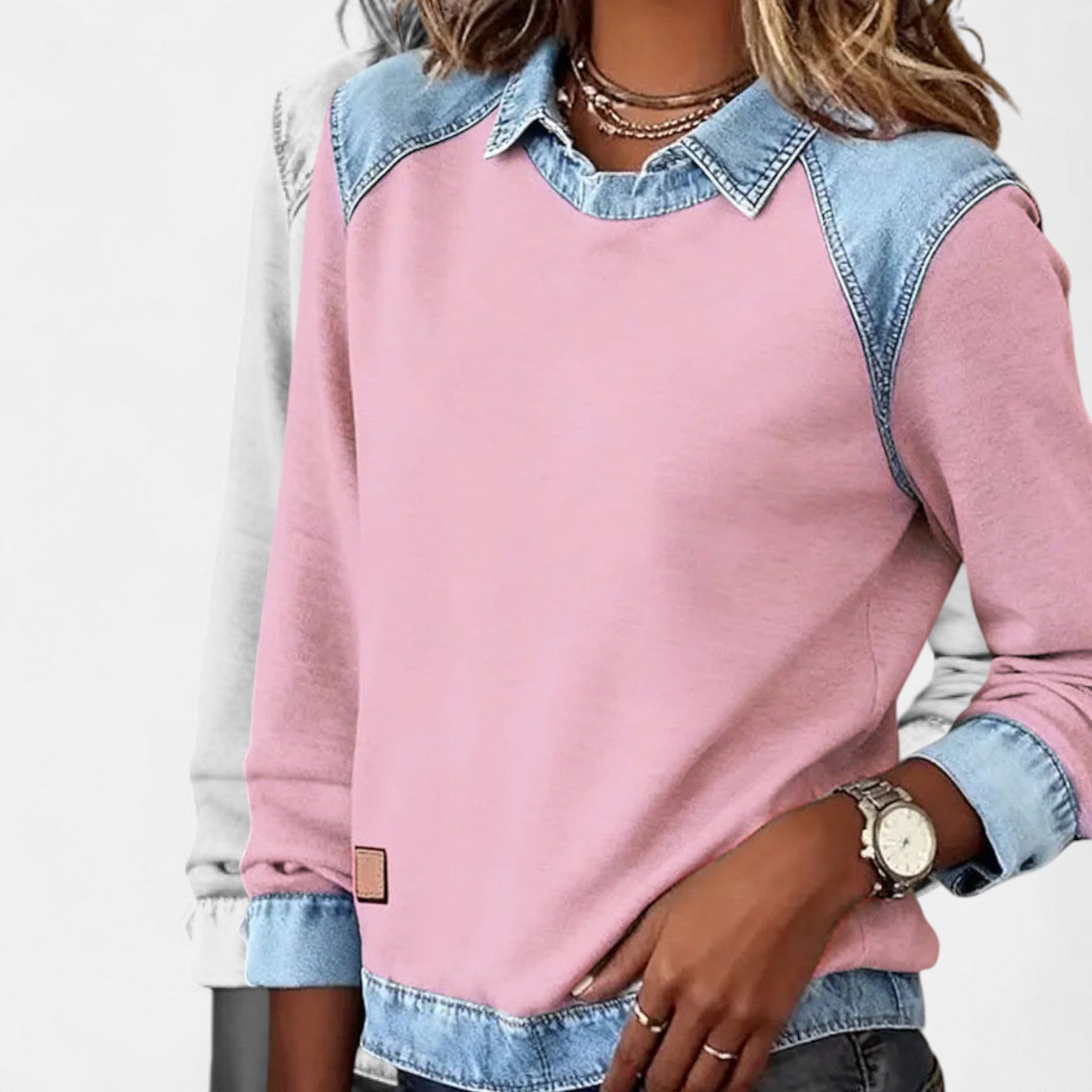 Long-sleeve knit sweater shown seated