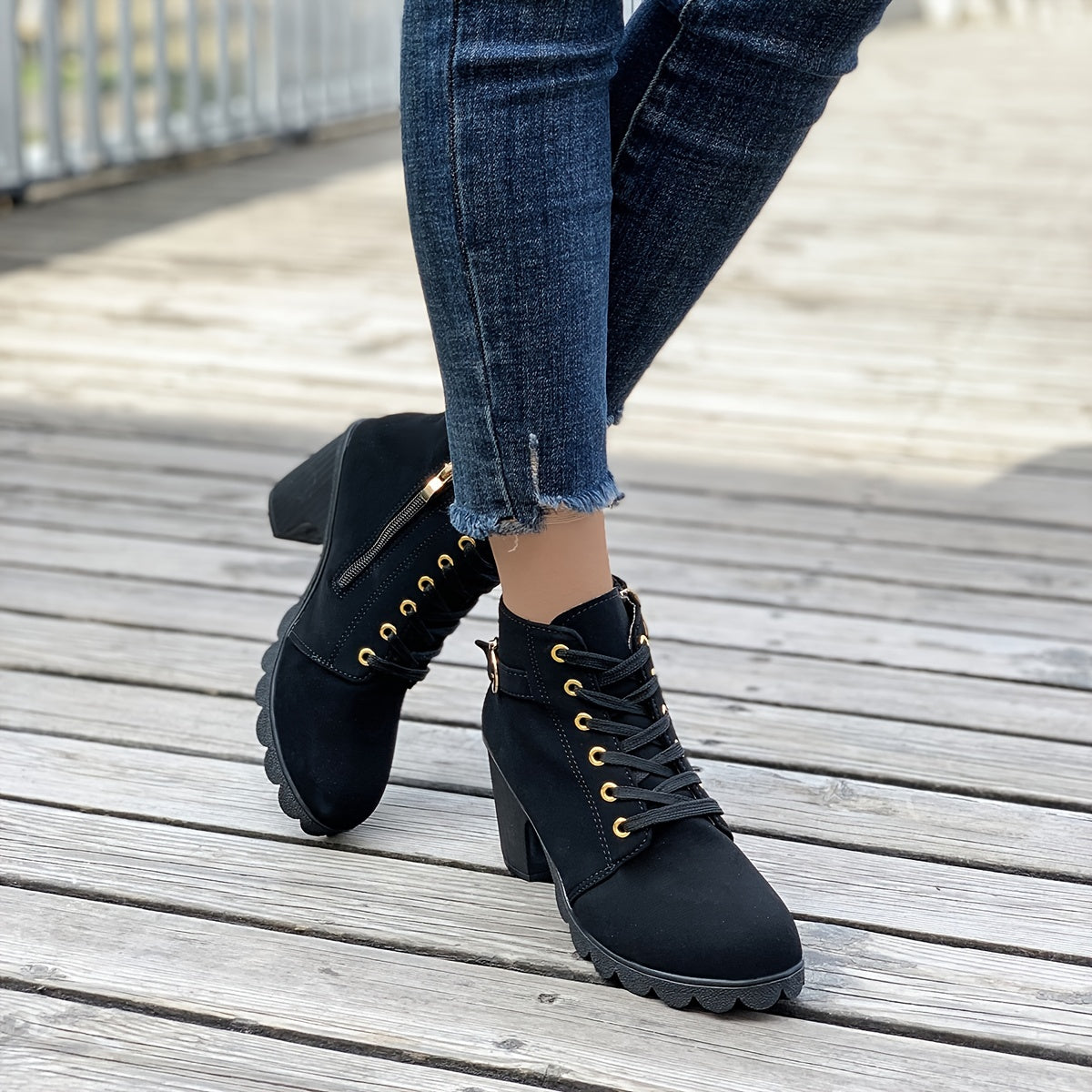 Ankle boots showing the lacing and buckle detail