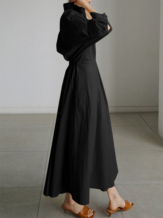 Long-sleeve dress photographed at an angle