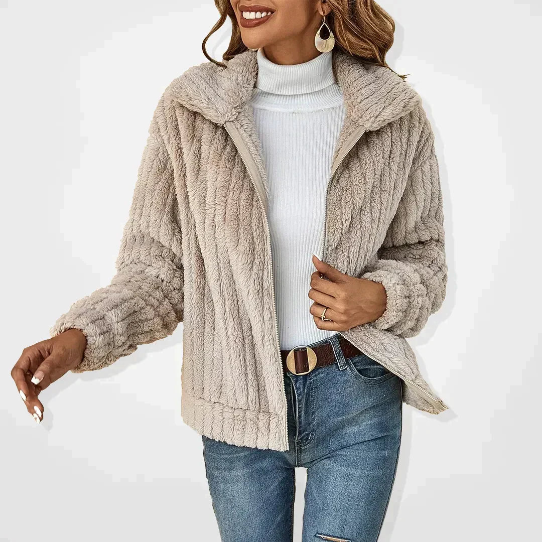 Plush cardigan shown in beige with the collar folded