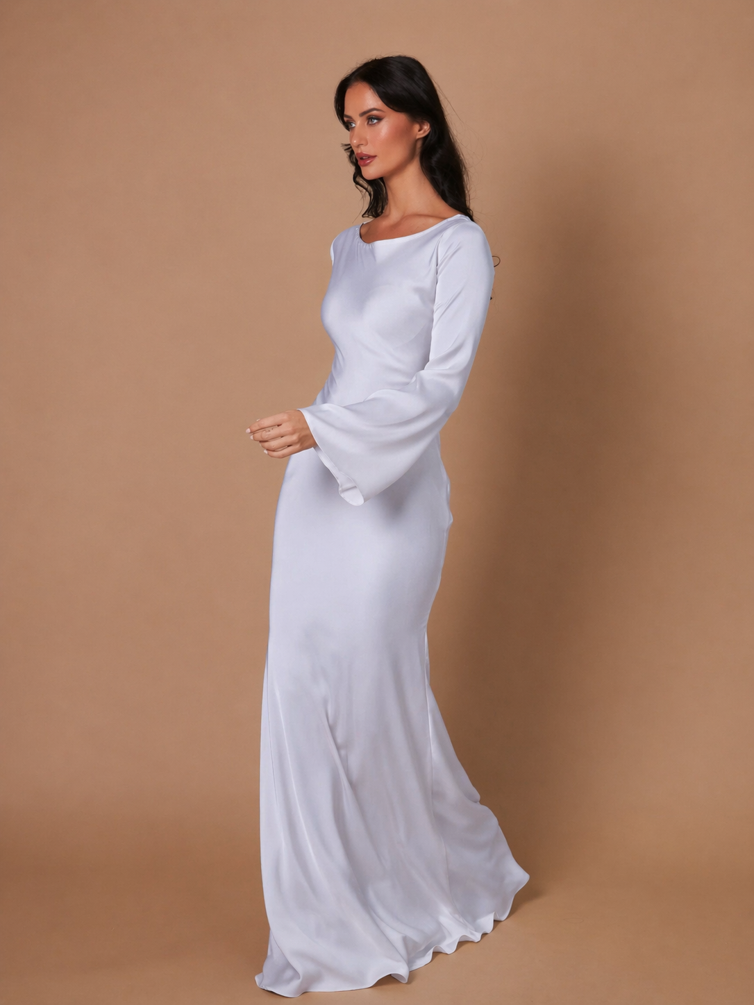 Draped-sleeve gown photographed at an angle