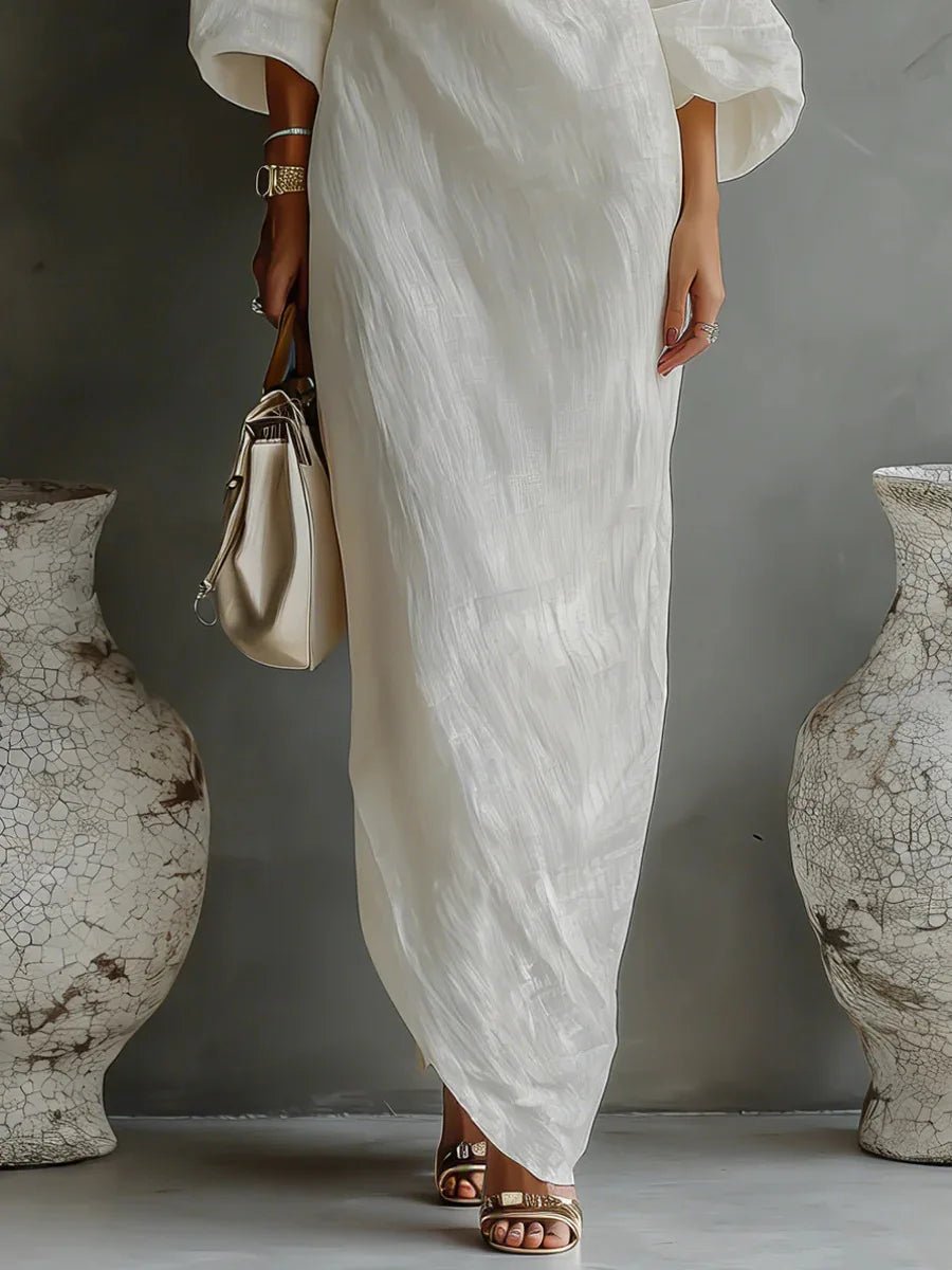 Maxi dress showing the batwing sleeve and diagonal hem