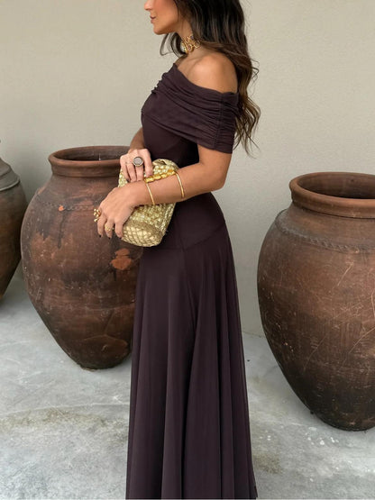 Brown mesh overlay dress photographed at an angle