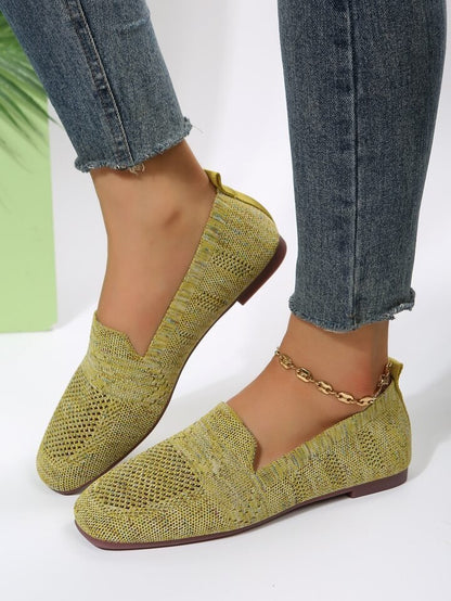 Knit loafers showing the low-profile outsole and slight heel