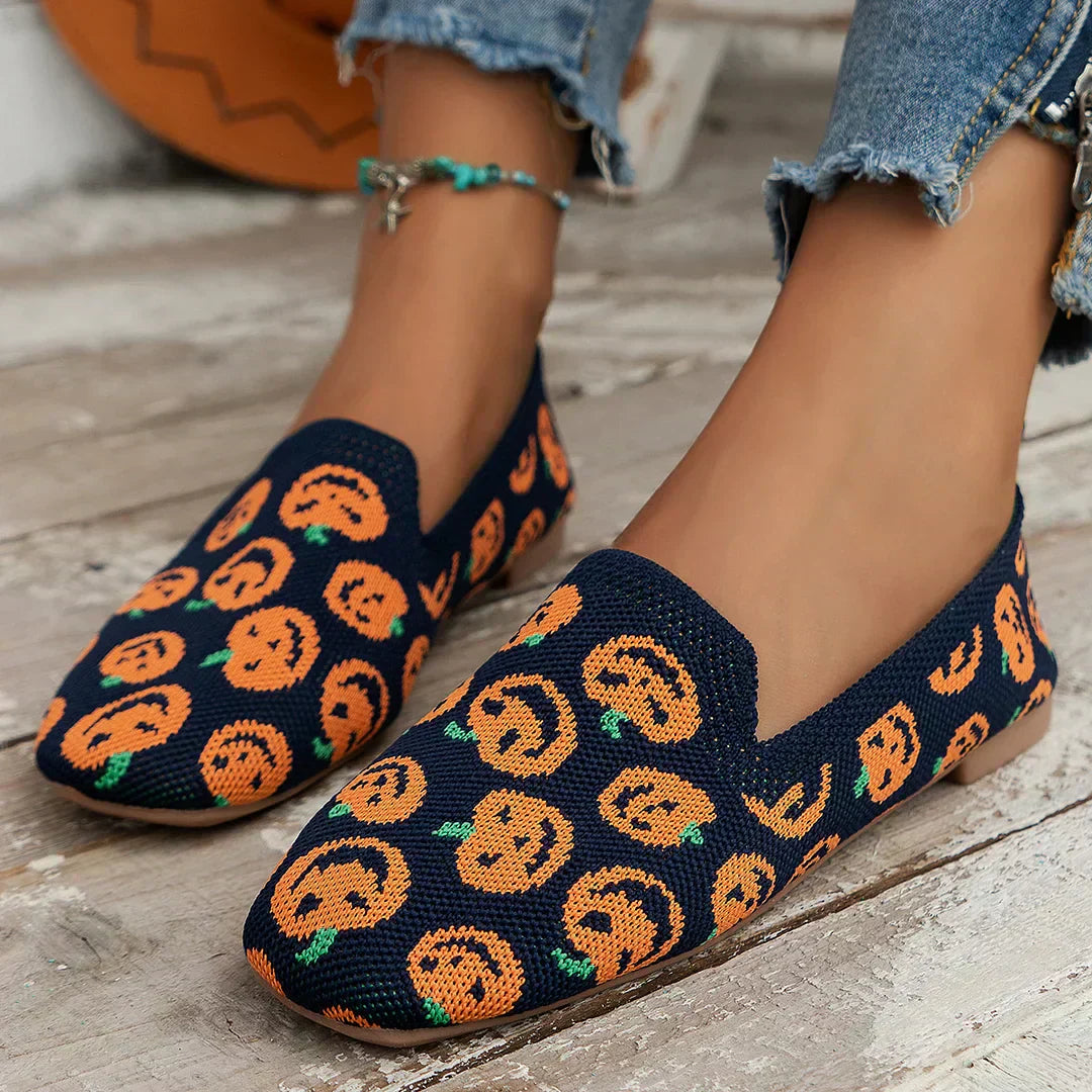 Perforated loafers showing the rounded toe cap