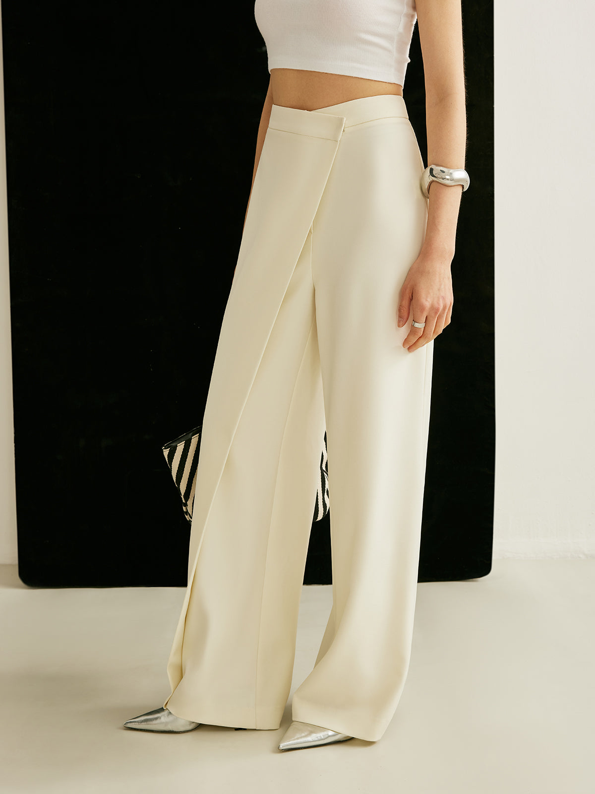 Wide-leg pants showing the wrap panel and high waistline