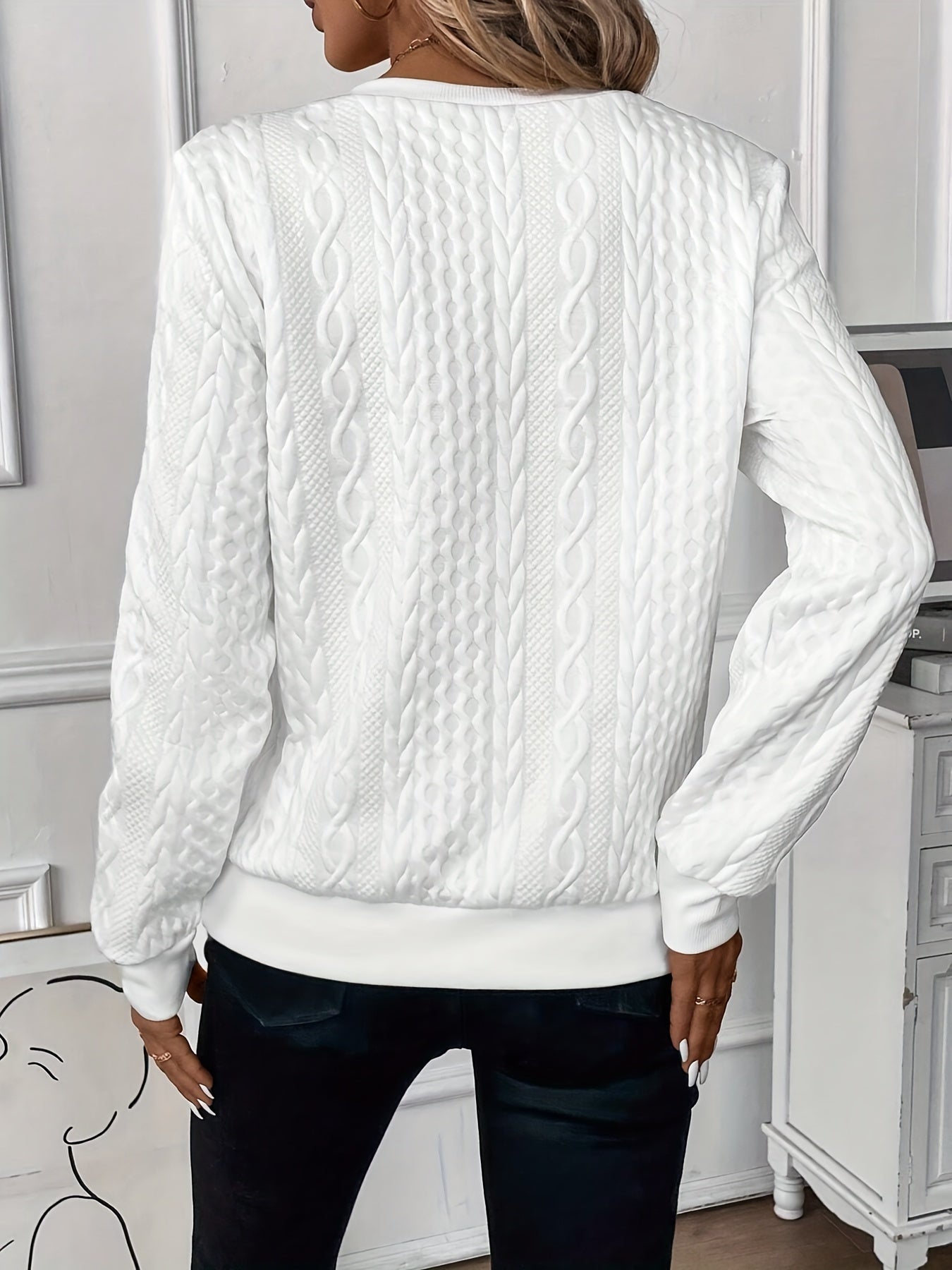 Cable-knit sweater showing the raised knit pattern