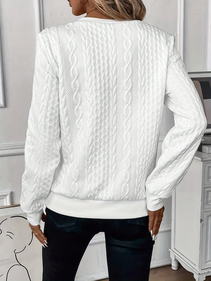 Cable-knit sweater showing the raised knit pattern