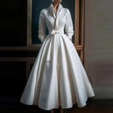 White long-sleeve A-line midi dress with a V-neckline, front view