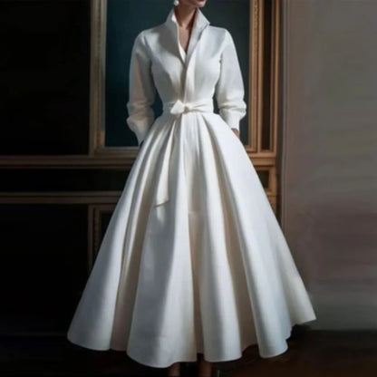 White long-sleeve A-line midi dress with a V-neckline, front view
