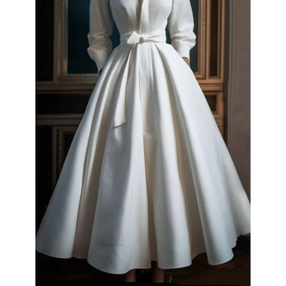 White long-sleeve midi dress shown from the side