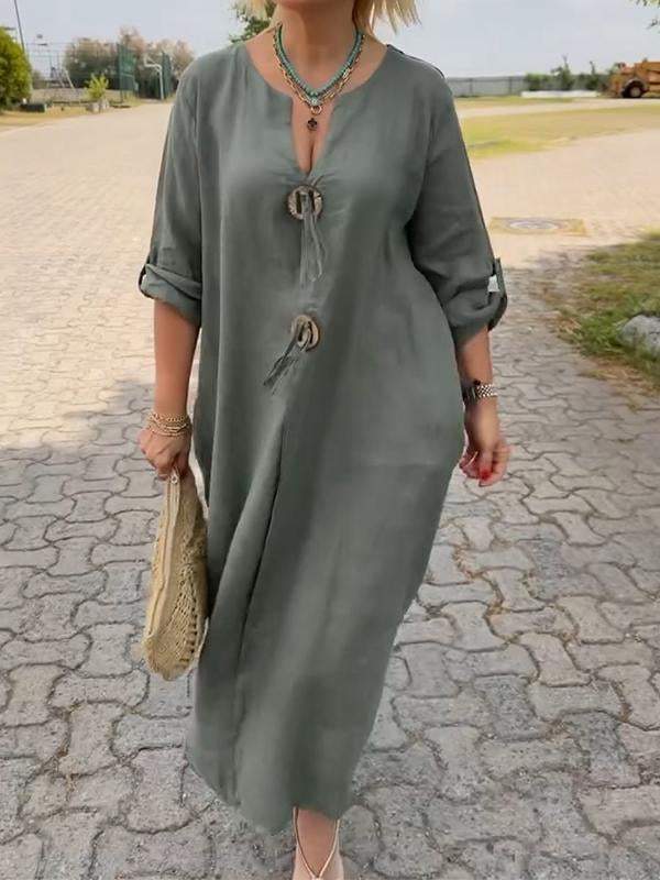 Long-sleeve dress showing the clean hemline