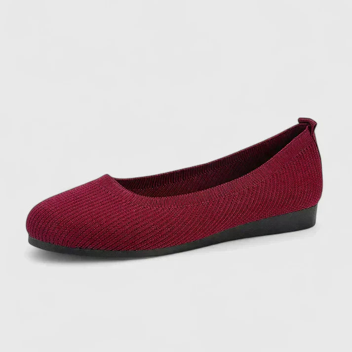 Flat loafers photographed at a three-quarter angle
