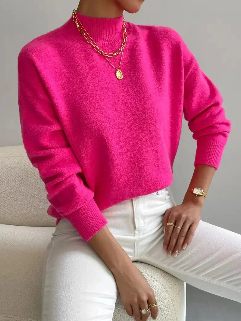Turtleneck sweater shown layered under a coat