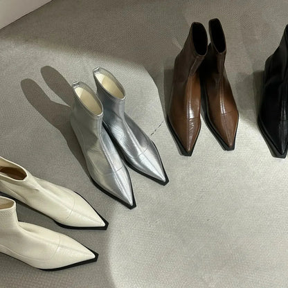 Pointed-toe boots shown from the back