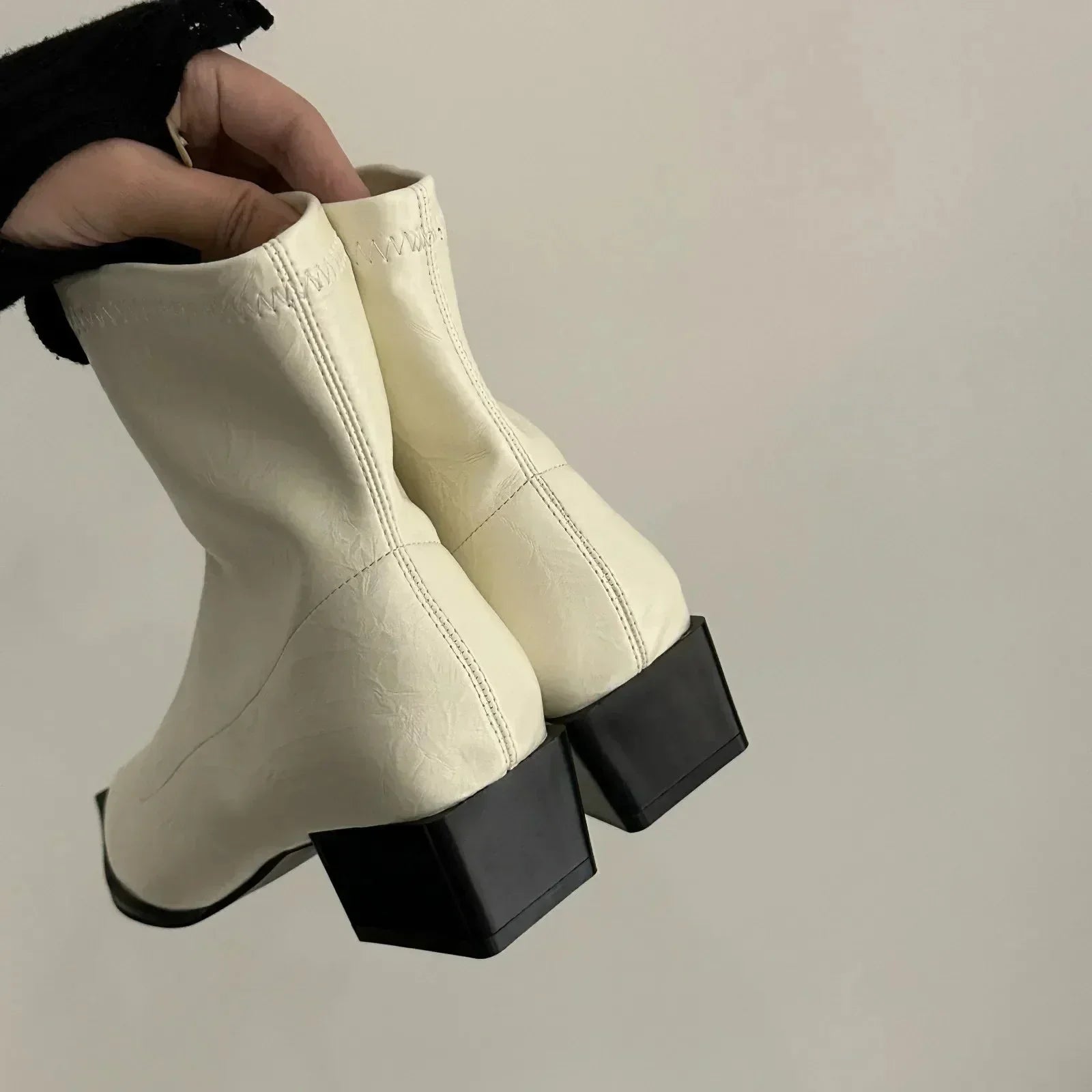 Block heel boots showing the pointed toe shape
