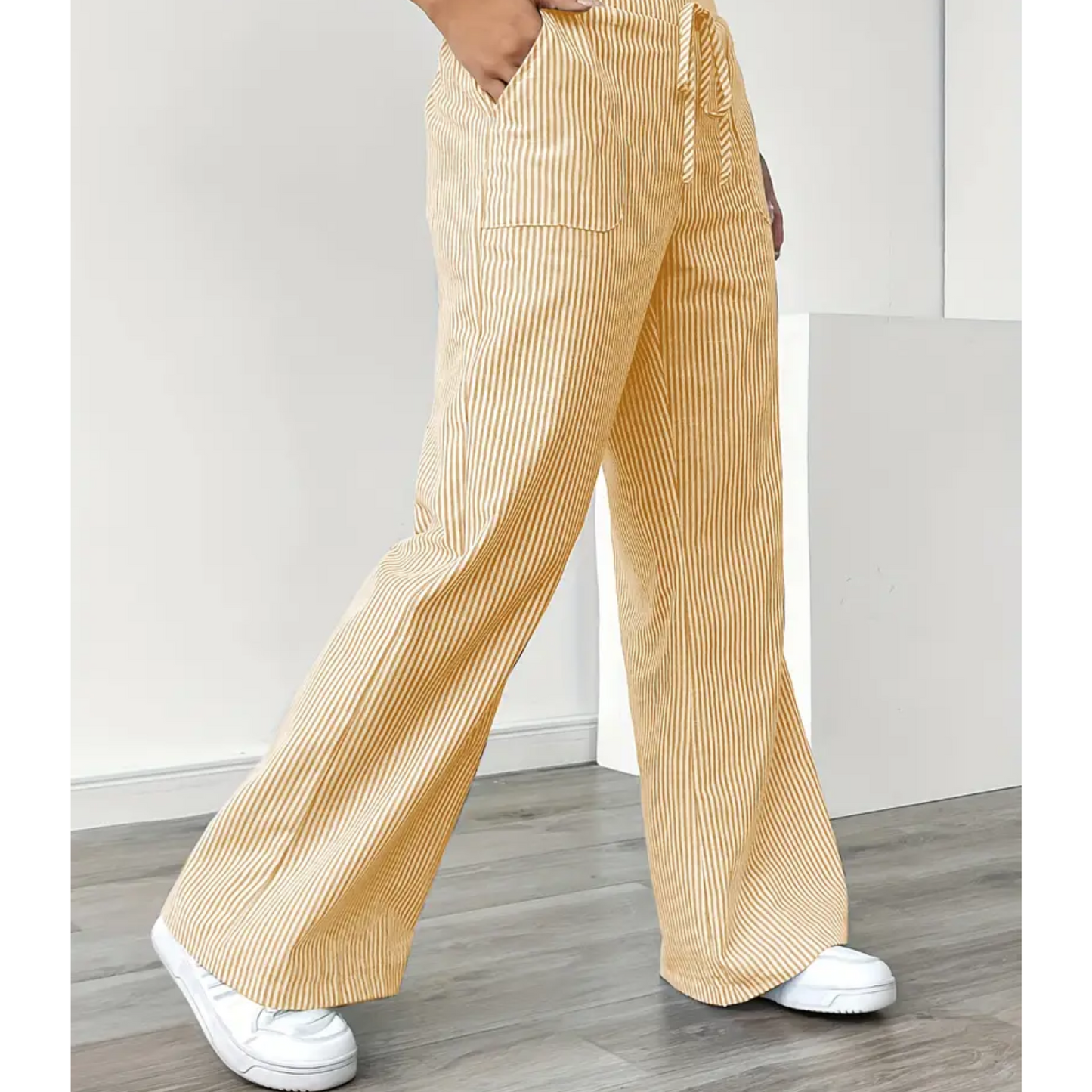 Striped wide-leg pants shown from the side