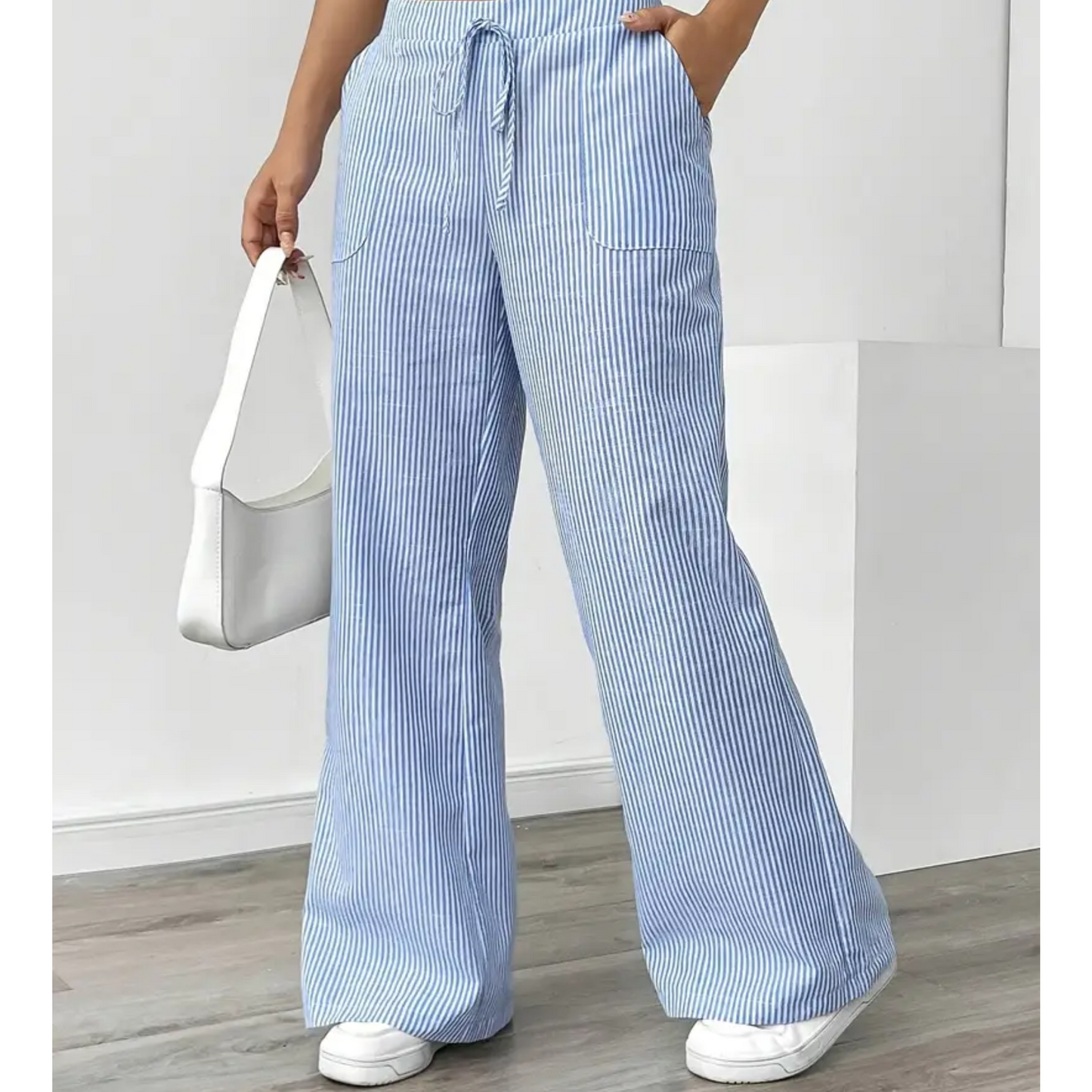 Wide-leg pants showing the drawstring waist and stripe detail