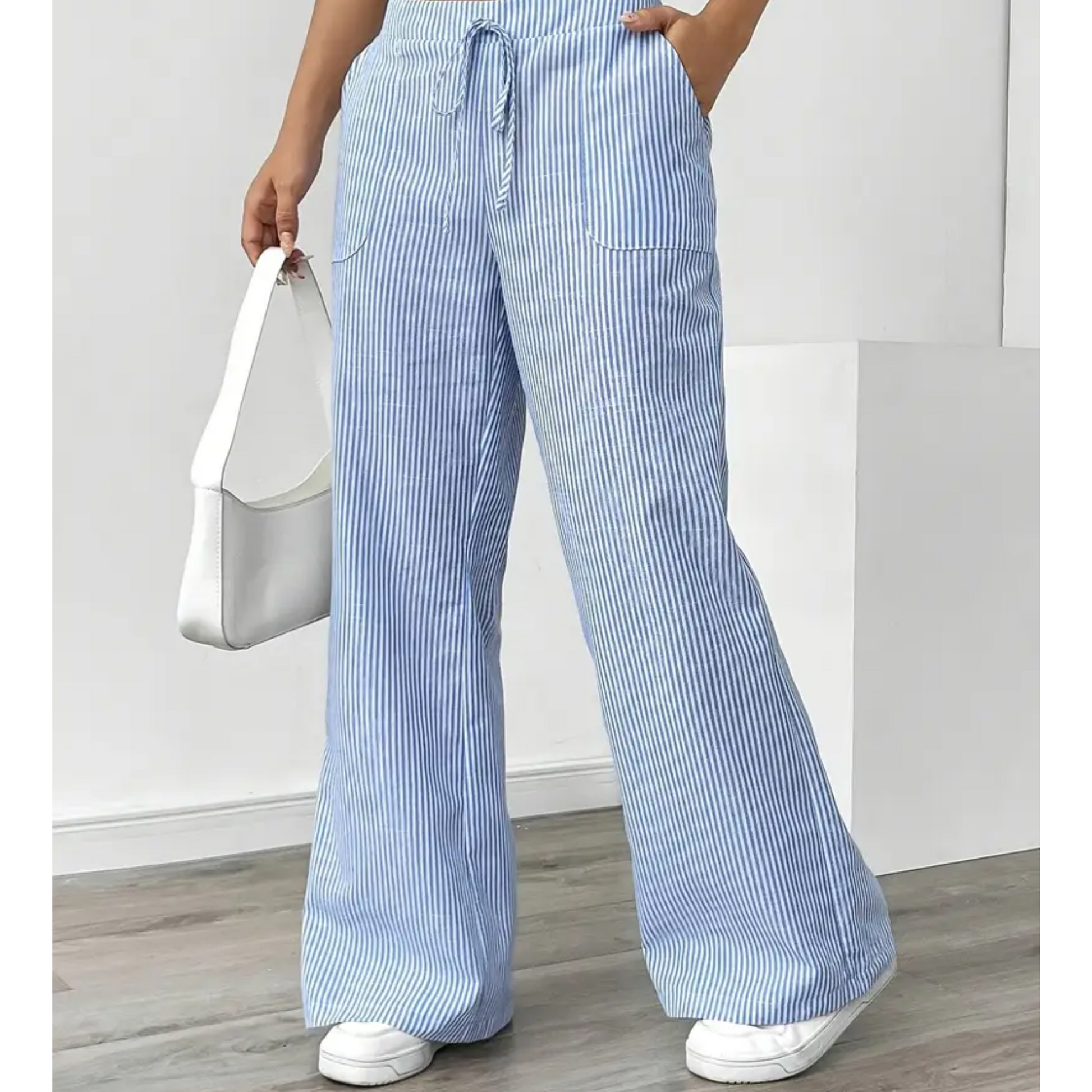 Wide-leg pants showing the drawstring waist and stripe detail