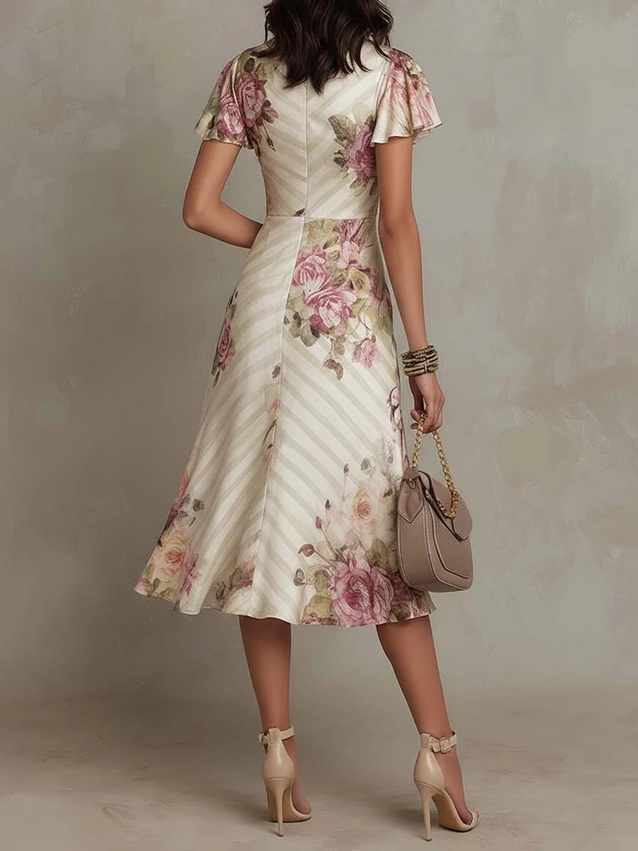 Floral midi dress showing the ruched side seam