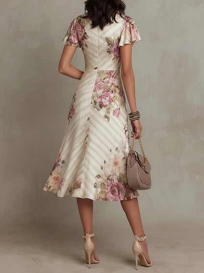 Floral midi dress showing the ruched side seam