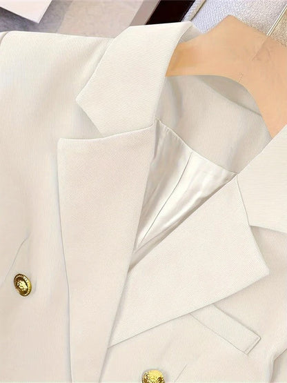 Close view of the buttoned cuff on a tailored blazer